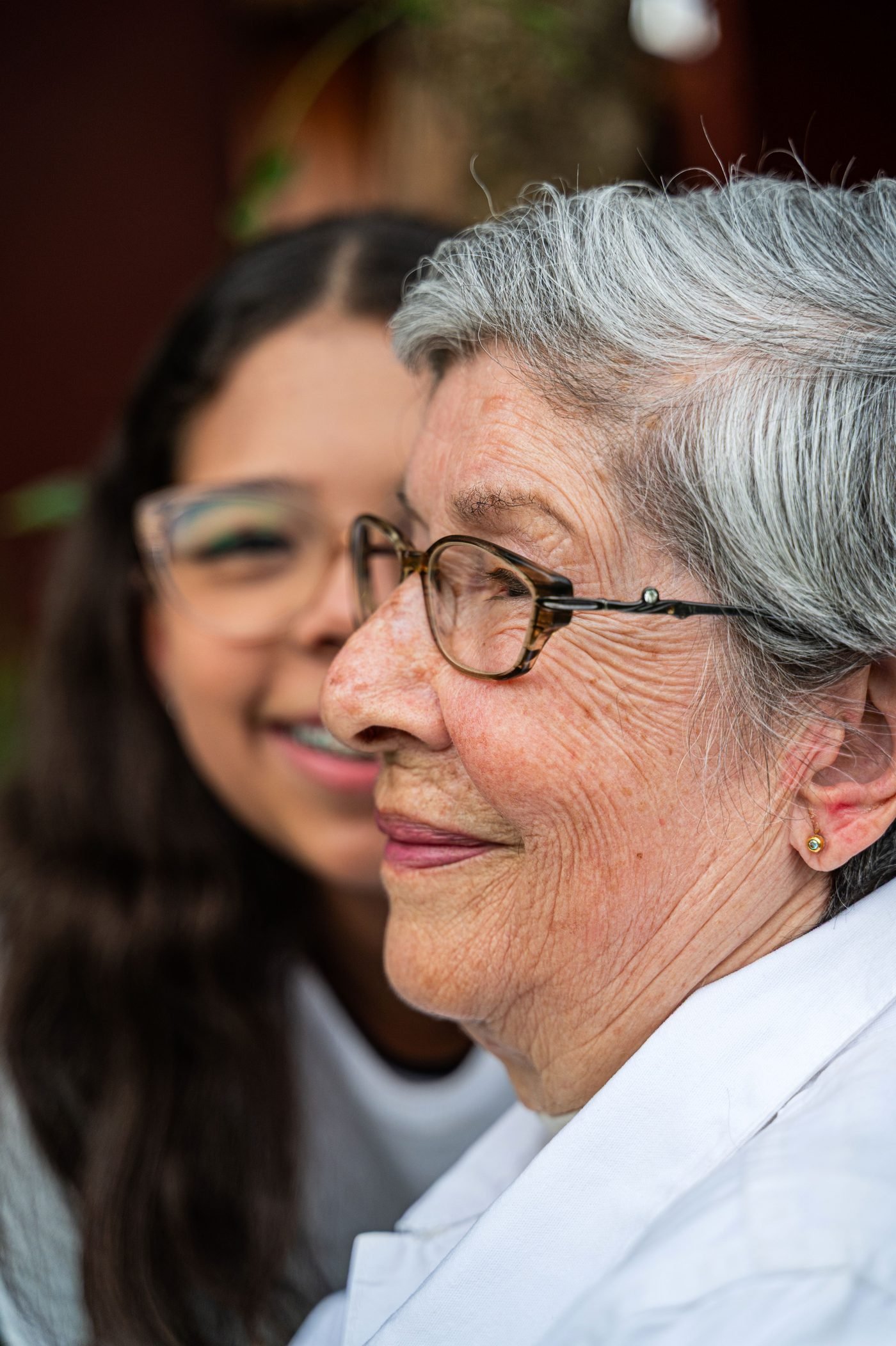 An older woman smiling with her companion